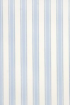 a blue and white striped wallpaper with vertical stripes