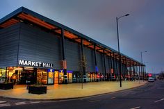 the market hall is lit up at night