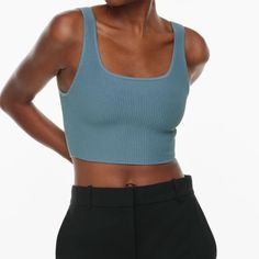 An Everyday Luxury Essential Loved For Its Universally Flattering Fit, This Is A Cropped Tank With A Double Square Neckline And Fully Fashioned Construction. It’s Made With Sculpt Knit Our Signature Figure-Enhancing Yarn. This Compressive, All-Season Fabric Holds You In All The Right Places To Shape And Sculpt Your Form. Like Nothing Else. This Version Is Constructed Using An Ottoman Stitch With Close Distinct Ribs For A Structured And Textural Feel. Features Fully Fashioned Construction Means Y Chic Stretch Blue Knit Top, Chic Blue Ribbed Top, Blue Scoop Neck Top With Seamless Construction, Fitted Blue Knit Top, Fitted Blue Trendy Knit Top, Fitted Light Blue Knit Top, Trendy Fitted Blue Knit Top, Blue Seamless Scoop Neck Top, Light Blue Fitted Knit Top