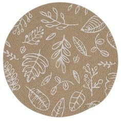 a brown and white rug with leaf designs on it's side, in the shape of a circle