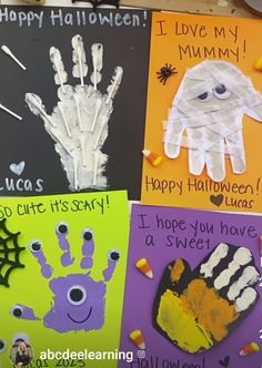 halloween handprints are displayed on the wall