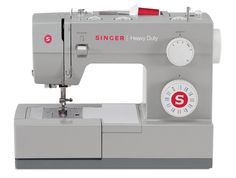 the singer heavy duty sewing machine is next to a sign that says, fast start