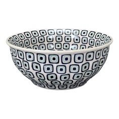 a bowl with blue and white designs on it's sides, in front of a white background