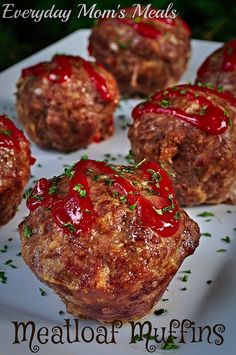 several meatballs covered in ketchup on a plate