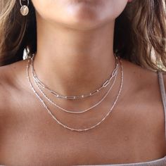 Our Gemma Chain features a timeless, dainty double rope that blends modern style with classic sophistication! It is perfect to wear alone or layer up with a fun necklace stack. DETAILS14k gold fill or sterling silverAvailable in 14", 16", 18", or 20"Hypoallergenic, waterproof, and nickel free Dainty Silver Necklace Stack, Gold And Silver Necklaces Layered, Silver Necklace Stack, Homecoming 2024, Silver Layered Necklace, Chain Necklace Silver, Necklace Stack, Sterling Silver Choker, Layered Necklaces Silver