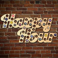 the word happy birthday spelled with beer bottle caps on a brick wall