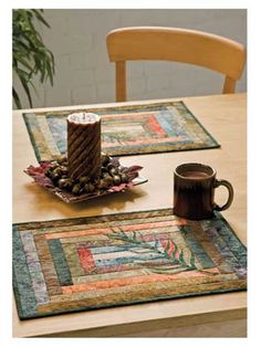 two placemats and a coffee cup on a table