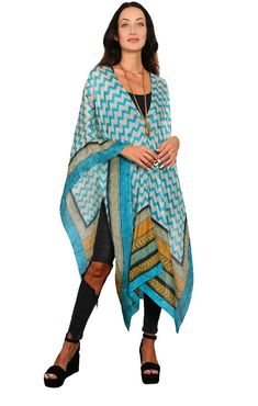 Our best seller know as our “Poncho” is a very easy to wear shape. It has open sides, a neckline in the center is the ESSENTIAL Travel Must have item! The poncho can be worn many ways such as shown; as a scarf, wrap around your hip as a sarong, one shoulder over a dress, and has many multi functions (see chart of many ways to wear). It’s the must have beach cover up and also looks great over jeans. We suggest you wear it on the plane to keep warm while traveling and this way you are sure you hav Chic Beach Cover-up Poncho, Beach Cape Shawl For Fall, Fall Beach Cape Shawl, One Size Bohemian Shawl Cape, Bohemian One Size Shawl Cape, Bohemian Cape Poncho For Vacation, Bohemian Poncho With Batwing Sleeve For Beach, Bohemian Poncho Cape For Vacation, Oversized Cape Shawl For Spring