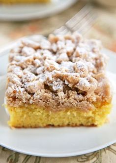 a piece of cake sitting on top of a white plate with a fork in it