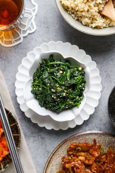 bowls of food and chopsticks on a table