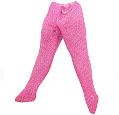 This vintage item from the 1980s brings back memories of Barbie's iconic fashion. The pink glitter footed leggings are a rare find and perfect for collectors. The item has some stains but does not detract from its overall appeal.  The pants are made for Barbie dolls and are perfect for those who want to recreate the 80s fashion. The glitter adds a touch of glamor and elevates the look. It is a must-have for vintage Barbie collectors and enthusiasts. Pink Tight Footless Legwear, Tight Pink Party Leggings, Pink Footless Tights, Pink Stretch Vintage Bottoms, Pink Thigh High Tights For Party, Pink Thigh-high Tights For Party, Pink Party Leggings, Pink Tight Leggings For Party, The 80s Fashion