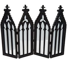 three black and white decorative mirrors with crosses on each one, set against a white background