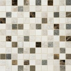 a white and brown tile wall with different colored tiles on the bottom, one is black