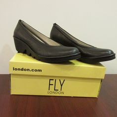 New In Box! Multiple Sizes! Black Wedge Pump Perfect For Casual Or Formal Wear, With Ultimate Comfort. Sizes 37 (Us 6.5), 38 (Us 7.5), And 41 (Us 10) Available. **Us Sizes Are Rough Estimates** Fly London Shoes, Wedge Pump, London Shoes, Black Wedge, Wedge Pumps, Fly London, Womens Shoes Wedges, Formal Wear, Wedges