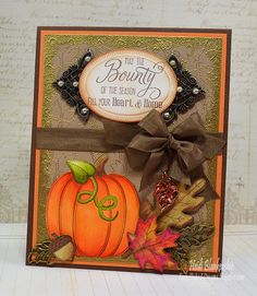 a handmade card with a pumpkin and leaves on the front, featuring an autumn saying