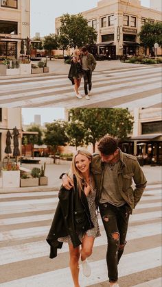 two people walking across a cross walk in front of some buildings and one person is holding his arm around the other