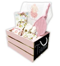 a pink box with baby items in it