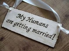 a wooden sign that says, my humans are getting married