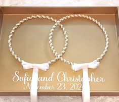 two wedding bracelets in a box with the words soft and christer on them