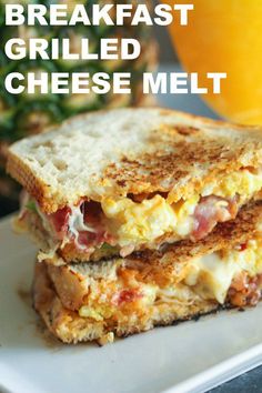 the breakfast grilled cheese melt sandwich is cut in half and stacked on top of each other