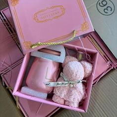 two pink boxes with teddy bears in them