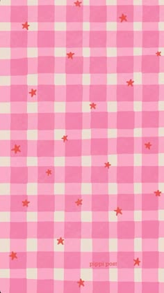 a pink and white checkered table cloth with stars on it