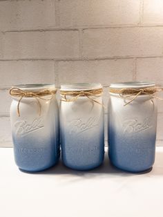 three blue mason jars tied with twine