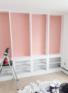 the room is being painted pink and white