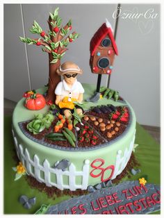 a cake decorated with an image of a chef in the garden