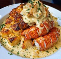 there is a plate with lobster and potatoes on it