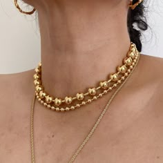 Introducing our exquisite 18K Gold Plated Stainless Steel Ball Chain Statement Necklace, a true embodiment of elegance. Crafted with precision, this necklace features a 5mm ball chain that is not only visually stunning but also resistant to tarnishing, ensuring its everlasting beauty. For reference, our model showcases the plain ball chain style at a length of 18 inches parting it with 17.5" 10mm ball chain. for the large ball chain please follow the link below https://www.etsy.com/listing/14934 Ball Necklace Gold, Elegant Gold-plated Ball Chain Jewelry, Elegant Gold Plated Ball Chain Jewelry, Elegant Ball Chain Jewelry For Formal Occasions, Elegant Formal Jewelry With Ball Chain, Elegant Gold Plated Necklaces With Ball Chain, Classic Gold Ball Chain Necklace, Gold Ball Chain Jewelry For Party, Gold Choker Necklace For Anniversary