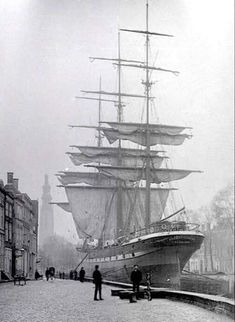 an old black and white photo of a ship in the water