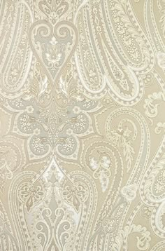 an ornate wallpaper pattern in beige and white colors with silver accents on the edges