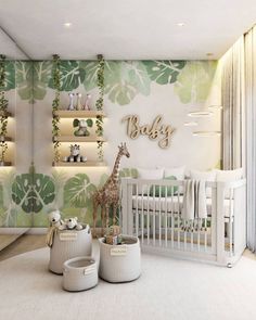 a baby's room decorated in green and white