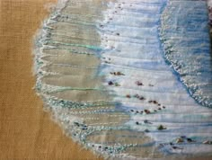 a piece of fabric with beading on it