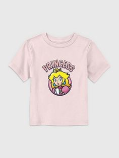 Toddler Nintendo Princess Peach Graphic Tee | Gap Pink Cute Shirt With Character Print, Cute Pink Shirt With Character Print, Playful Cotton T-shirt By Gap, Casual Cartoon Print Tops By Gap, Gap Cotton Tops With Character Print, Casual Gap Tops With Cartoon Print, Gap Pink Crew Neck Top, Playful Gap Short Sleeve T-shirt, Gap Graphic Tee With Character Print