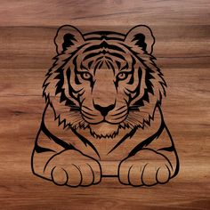 a tiger sitting on top of a wooden floor