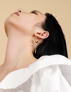 Presented in sterling silver, brass, or resin, Naida is accentuated with a signature blob, and tipped with a mini droplet to complete the vibe. Without excess elements, this piece is lending a luxurious yet elegant appeal.- 14K gold plated brass- sterling silver ear post with 14K gold plating- 7cm (2.8in) drop- handcrafted jewelryDelivered in vacuumed package with unique production number, accompanied by a pouch. Seen | Unseen series conveys another contrasting architectural relations, transpare Drop Earrings Gold, The Vibe, Gold Drop Earrings, Earrings Gold, Gold Plating, Gold Earrings, Gold Plate, Hoop Earrings, Plating