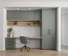 an office with grey cabinets and a gray chair