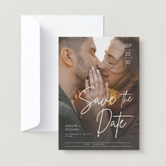 save the date card with an image of a man kissing a woman's forehead