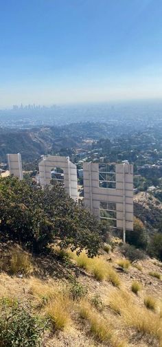 the view from top of a hill with buildings in the distance