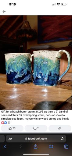 two coffee mugs sitting next to each other on top of a wooden table in front of an instagram page