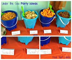 there are four buckets full of food on the table and labeled under the sea party ideas