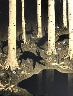 an image of deer in the woods at night with trees and flowers around them, as well as water