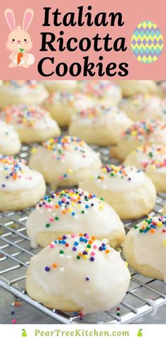 italian iced cookies with white frosting and sprinkles on a cooling rack