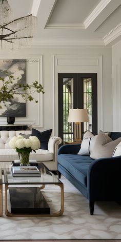 a living room filled with furniture and a chandelier