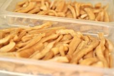 two plastic containers filled with food on top of a table