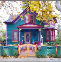 a blue house with red and yellow trim