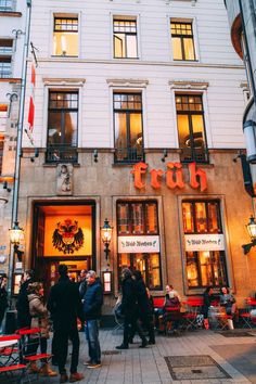 people are standing in front of a building