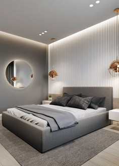 a bedroom with a large bed and round mirror on the wall above it's headboard